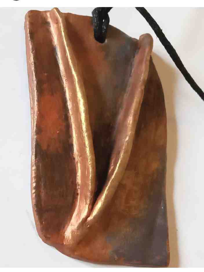 Hand sculpted pendant necklace.